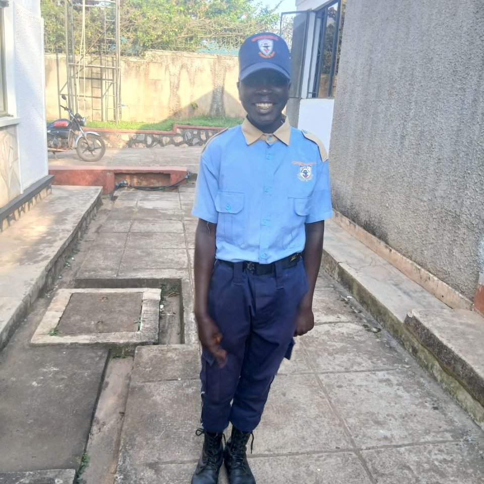 A smiling Neptune guard in a light-blue shirt