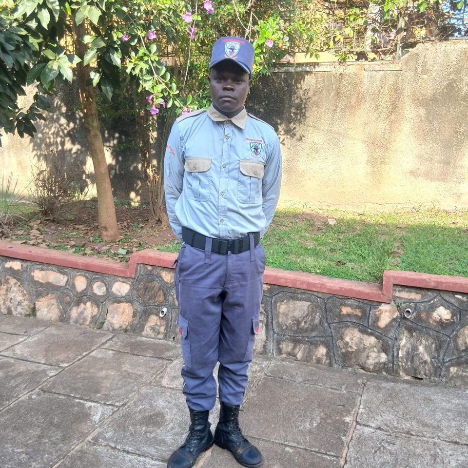 A Neptune guard standing at ease on a garden path