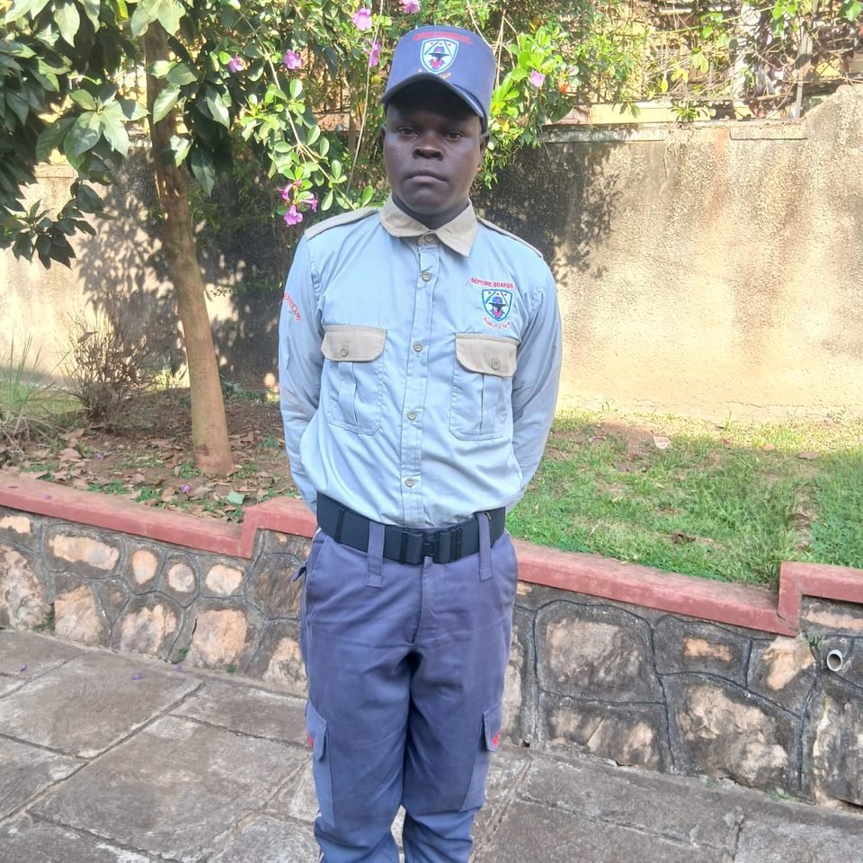 A Neptune guard in uniform and cap standing at his post