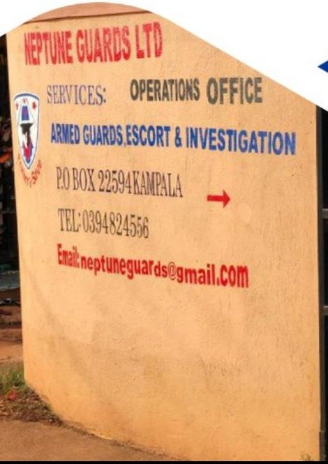 Painted sign at the Neptune Guards operations office listing armed guards, escort and investigation services